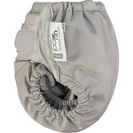 A side view of the Close Pop-In reusable cloth nappy with adjustable velcro, in Cloud grey.