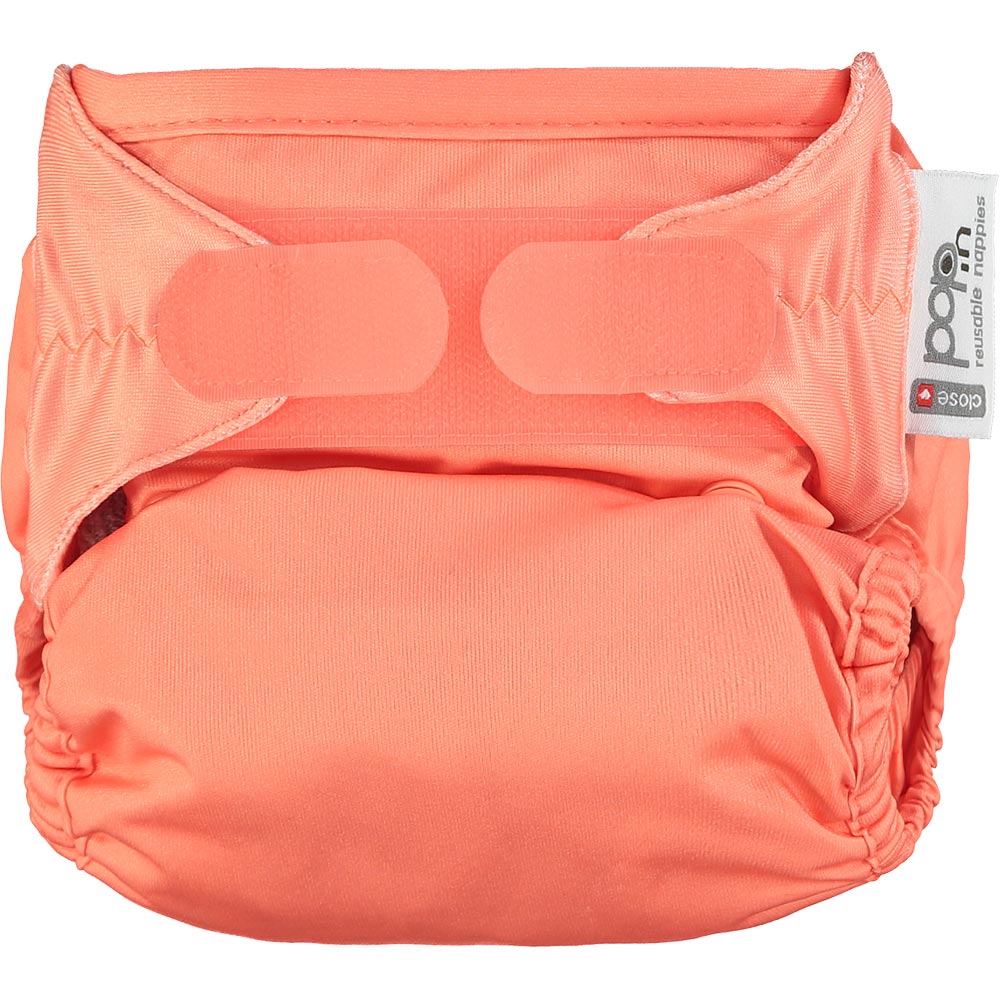 The Close Pop-In reusable cloth nappy with adjustable velcro, in coral pink