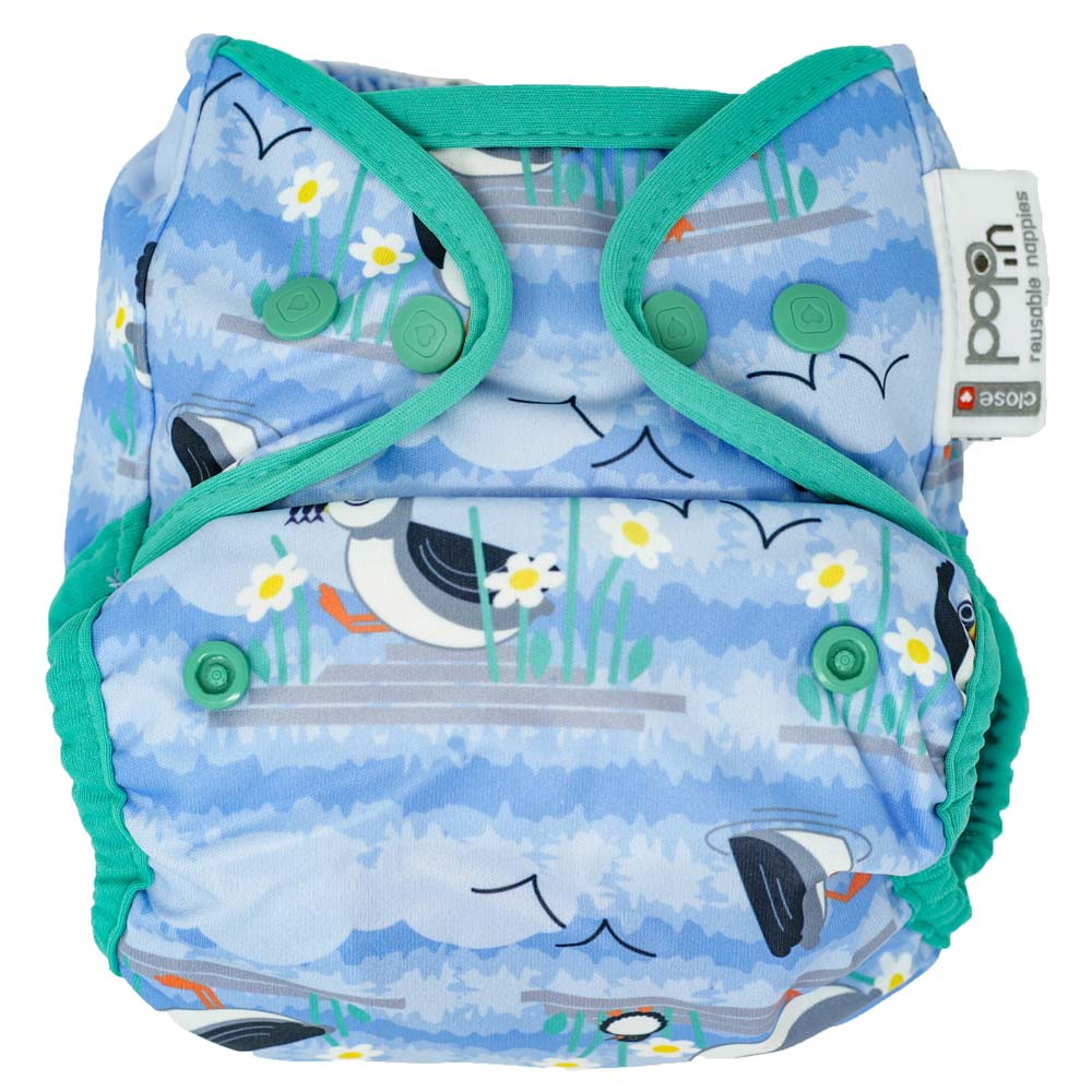 The Close Pop-In +bamboo reusable cloth nappy with adjustable popper closures, in a puffin print