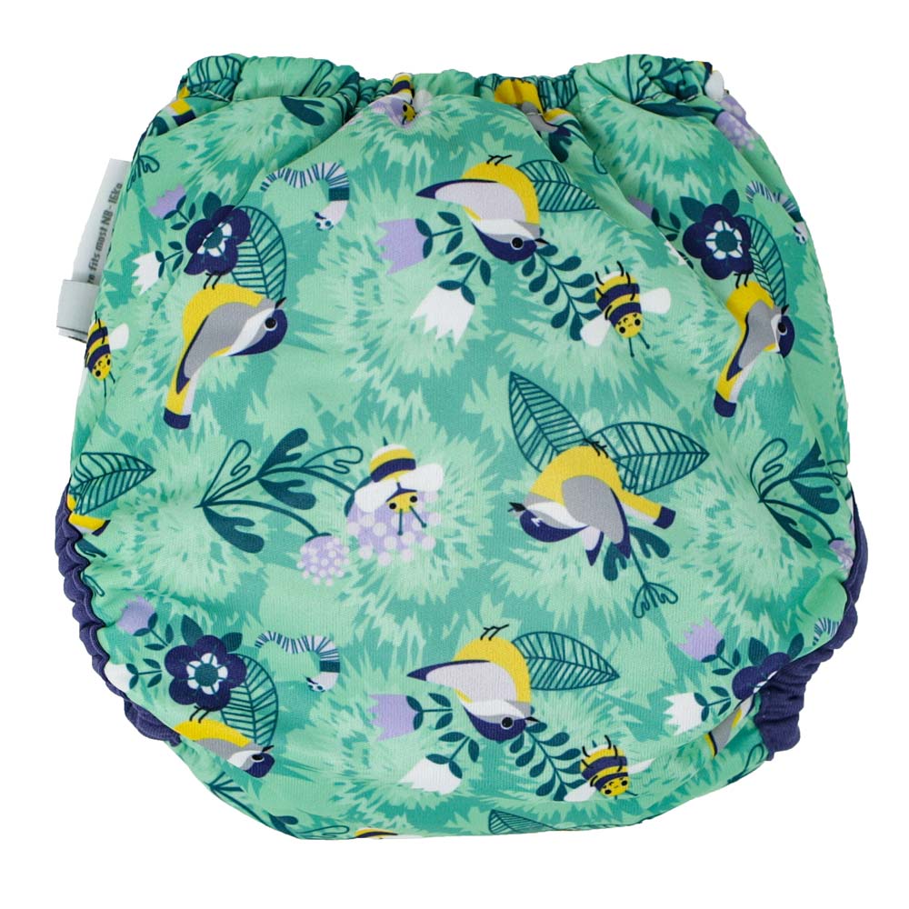 The back of the Close Pop-In +bamboo reusable cloth nappy with adjustable popper closures, showcasing the round the garden print