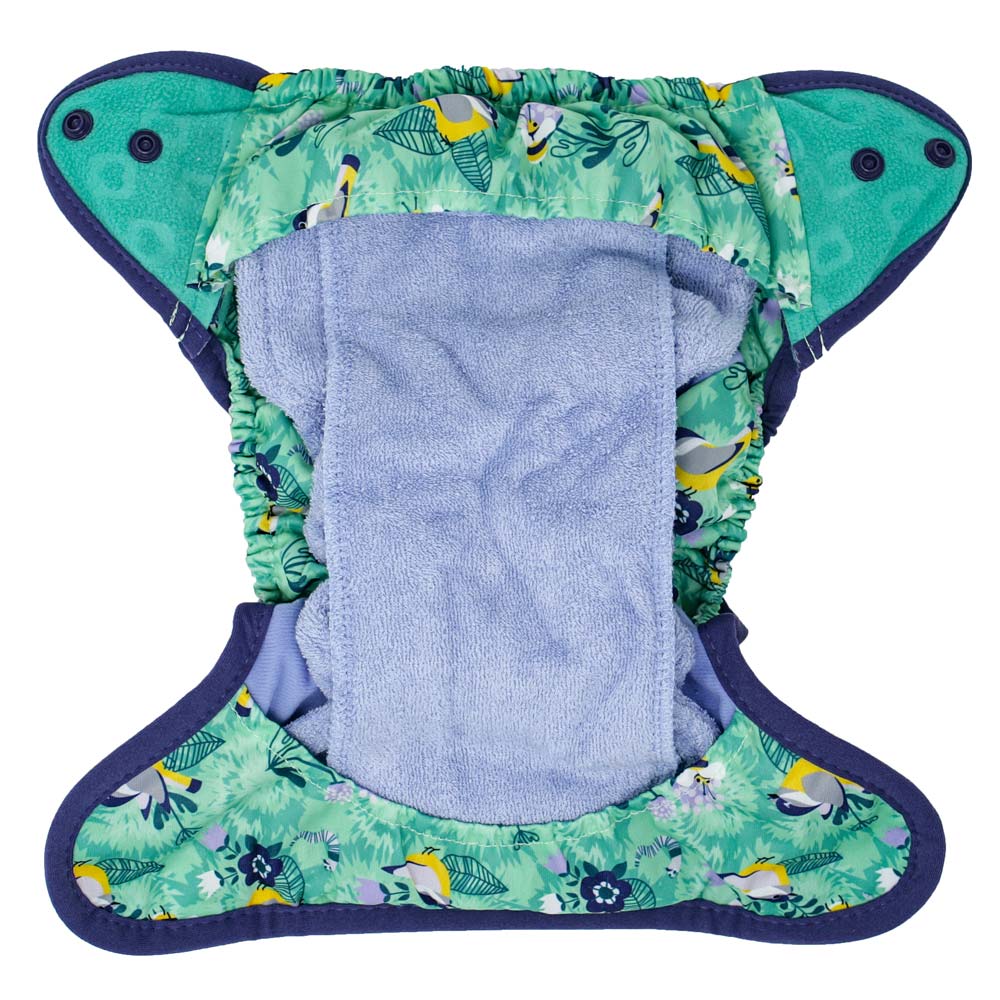 The Close Pop-In +bamboo reusable cloth nappy with adjustable popper closures, opened to show the bamboo lining