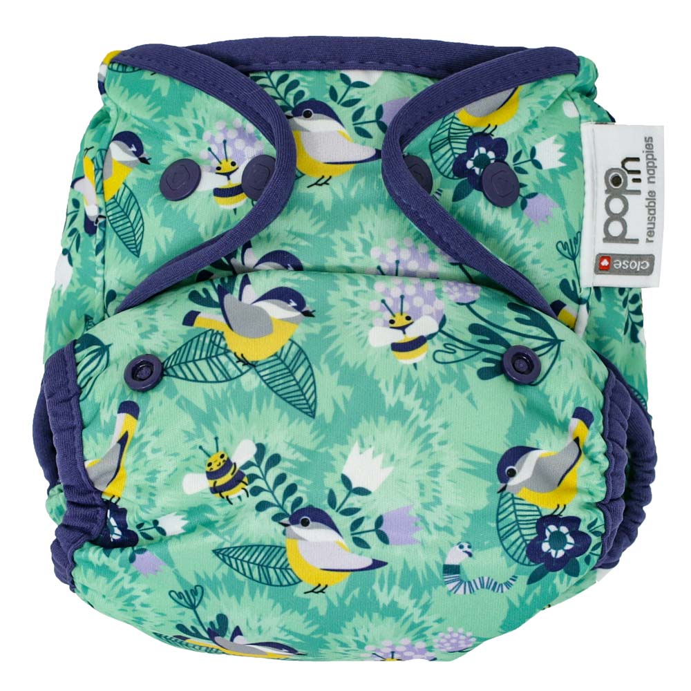 The Close Pop-In +bamboo reusable cloth nappy with adjustable popper closures, in a round the garden print