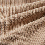 A close up of the material of the Rapanui Brook Organic Cotton Women's Knitted Cardigan. The material has been scrunched together.