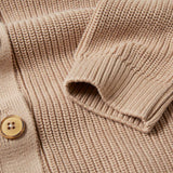A close up of teh sleeve cuff on the Rapanui Brook Organic Cotton Women's Knitted Cardigan.