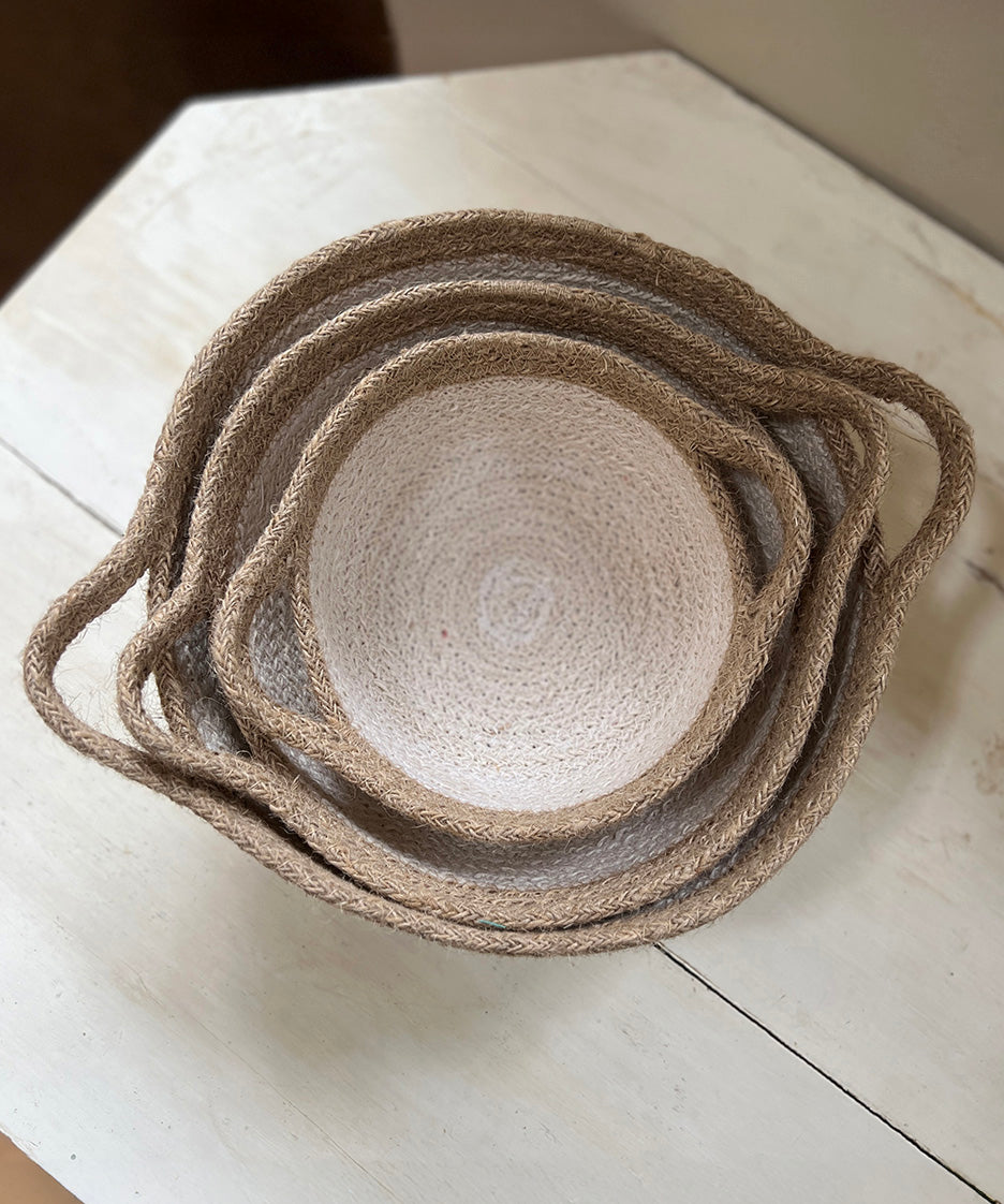 A top down view of the Respiin white and natural jute handled bowls showing each bowl inside each other