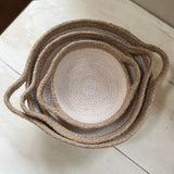 A top down view of the Respiin white and natural jute handled bowls showing each bowl inside each other