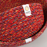 A close up of the 3 Respiin multicoloured recycled cotton bowls showing the weave detail and brand patch stitched on the rim