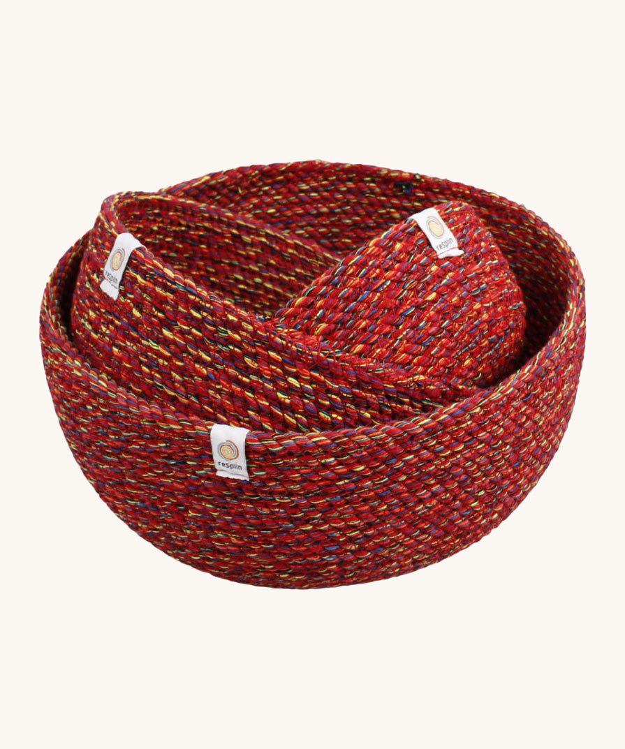 A set of 3 Respiin recycled cotton bowls in vibrant red with multicoloured weave in large medium and small size