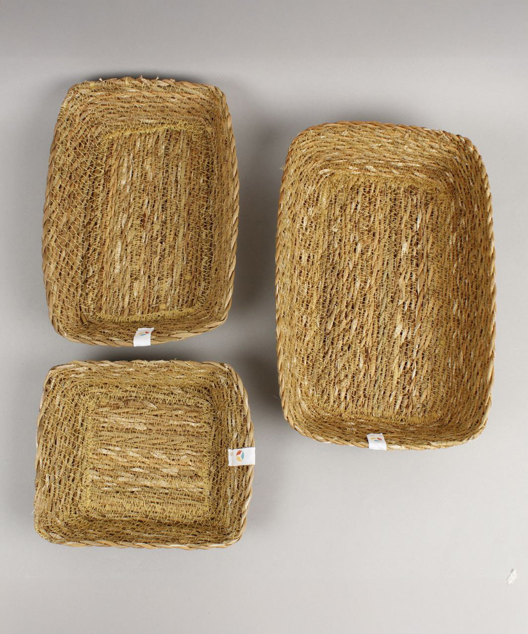 A top down view of the Respiin rectangular seagrass baskets showing the size difference between each basket