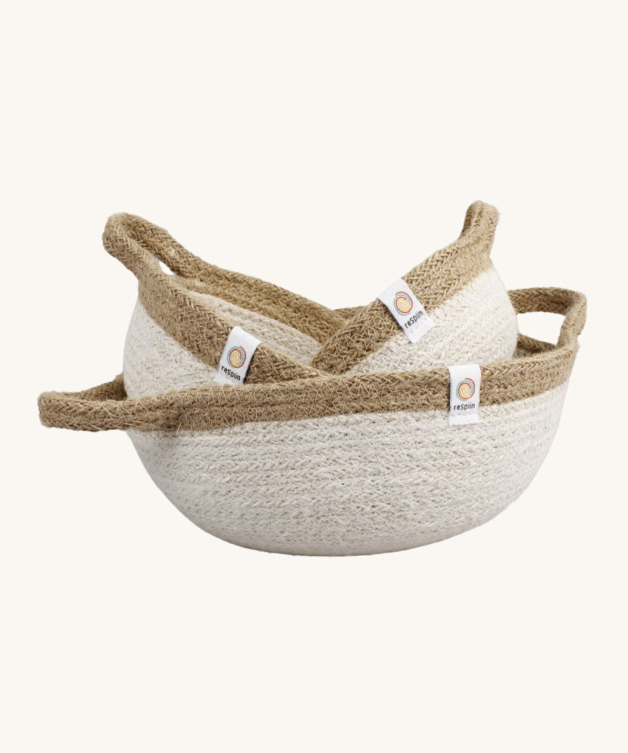 A set of 3 Respiin jute handled bowls in white and natural. Showing the smaller bowls inside the larger bowl.
