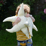 A child holding up a small and large Senger starfish soft toys in front of his face. The Senger starfish are part of a wide range of organic soft toys available here at babipur. Made from organic materials and natural fillings. The Senger starfish are part of a wide range of organic soft toys available here at babipur.