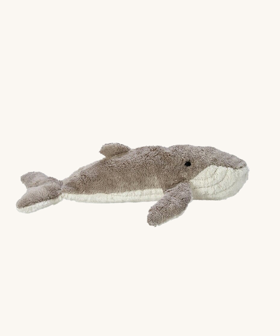 The Senger organic cotton cuddly whale stuffed animal toy, with a grey and white fluffy body.