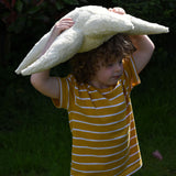A child carrying the large Senger starfish on his head. The Senger starfish are part of a wide range of organic soft toys available here at babipur.