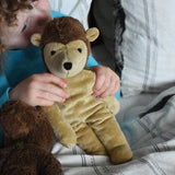 A child cuddling the Senger small floppy hedgehog soft toy, the child has both his hands holding the hedgehogs shoulders. The hedgehog is part of a wider selection of soft toys made with organic cotton and natural fillings that are available at Babipur.