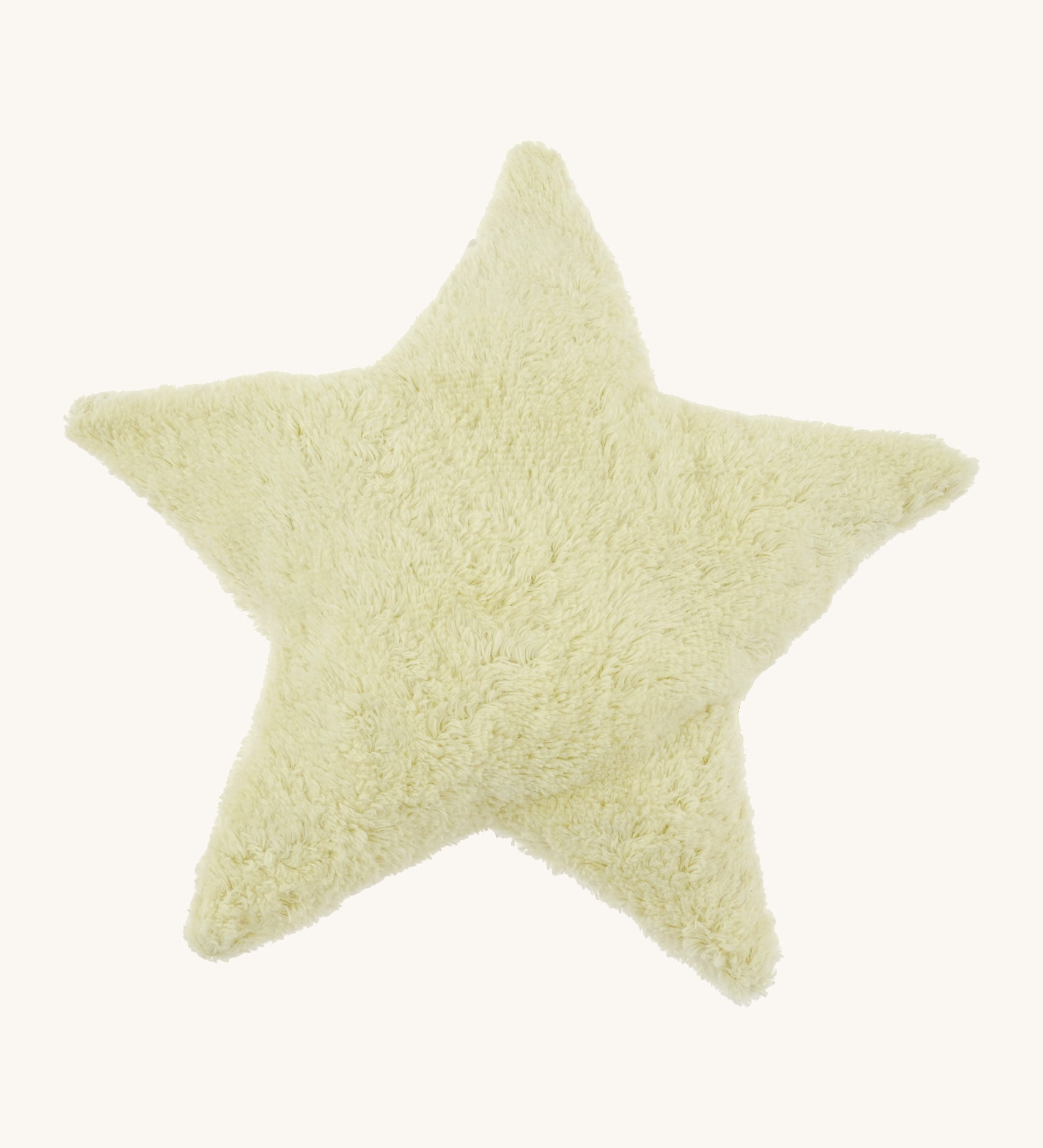 Senger warming star cushion. A light yellow fluffy GOTS organic cotton cushion that can be warmed up.