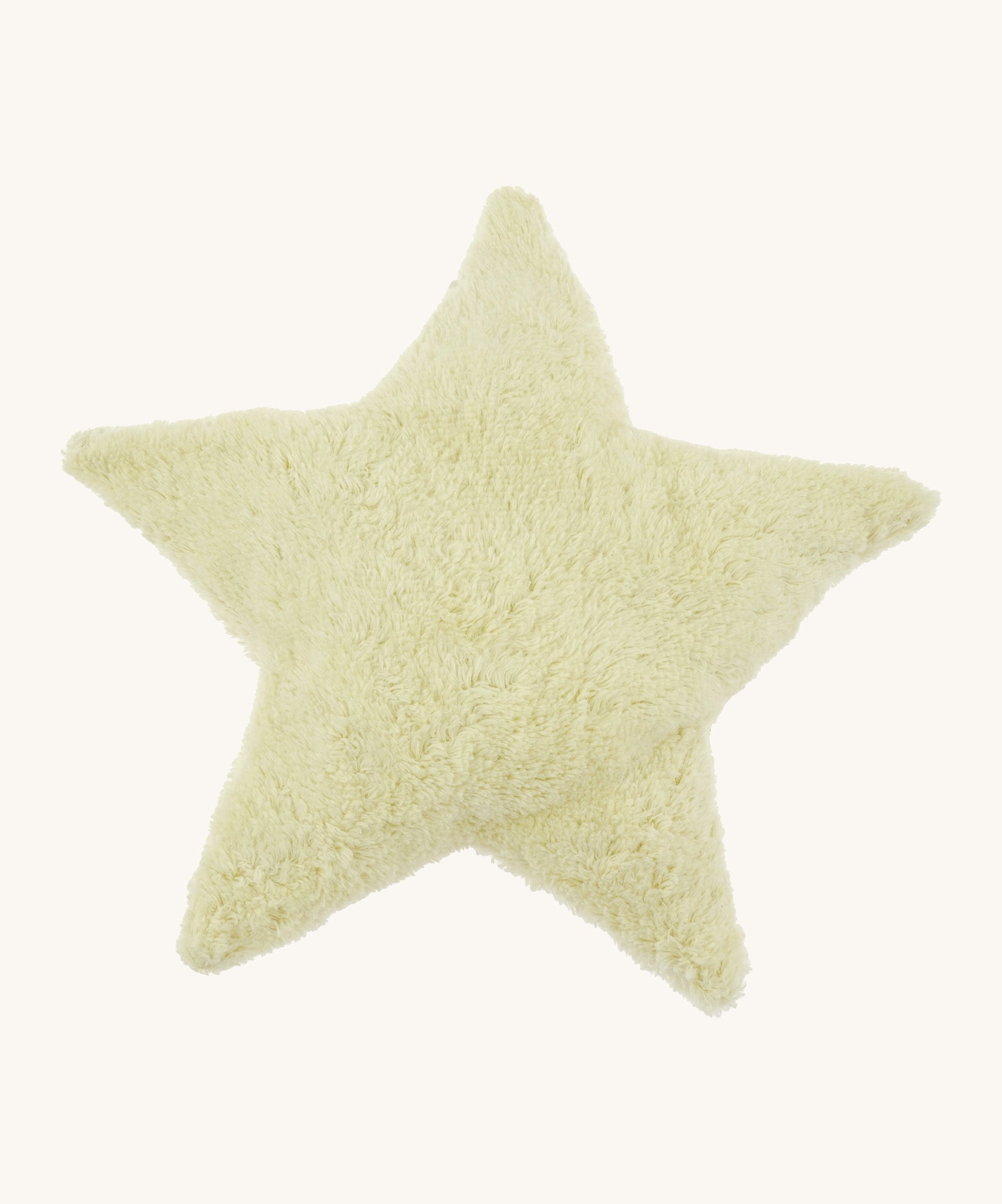 Senger warming star cushion. A light yellow fluffy GOTS organic cotton cushion that can be warmed up.