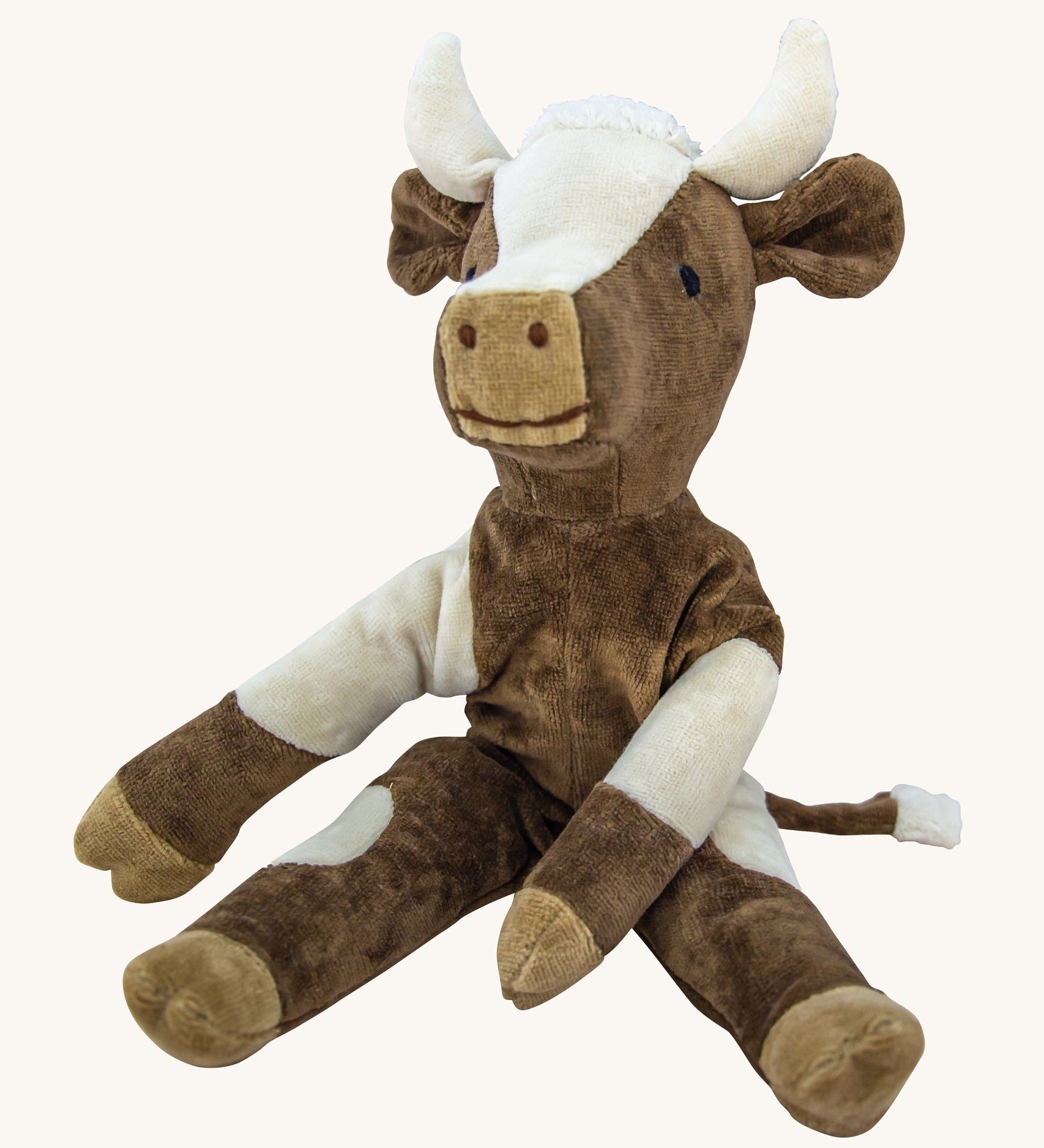 Senger Small Floppy Cow soft toy in a sitting position.
