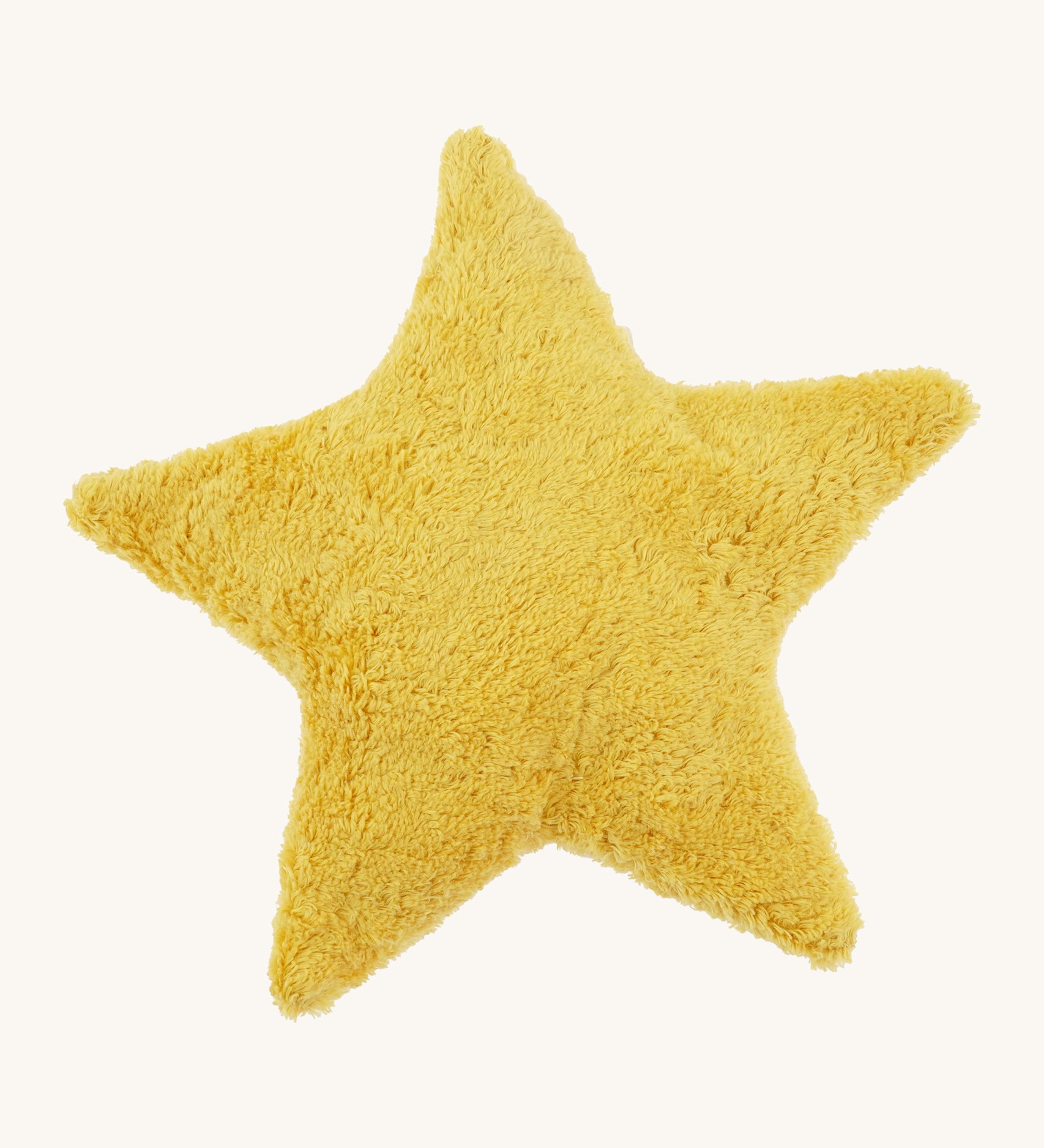 Senger warming star cushion. A yellow fluffy GOTS organic cotton cushion that can be warmed up.