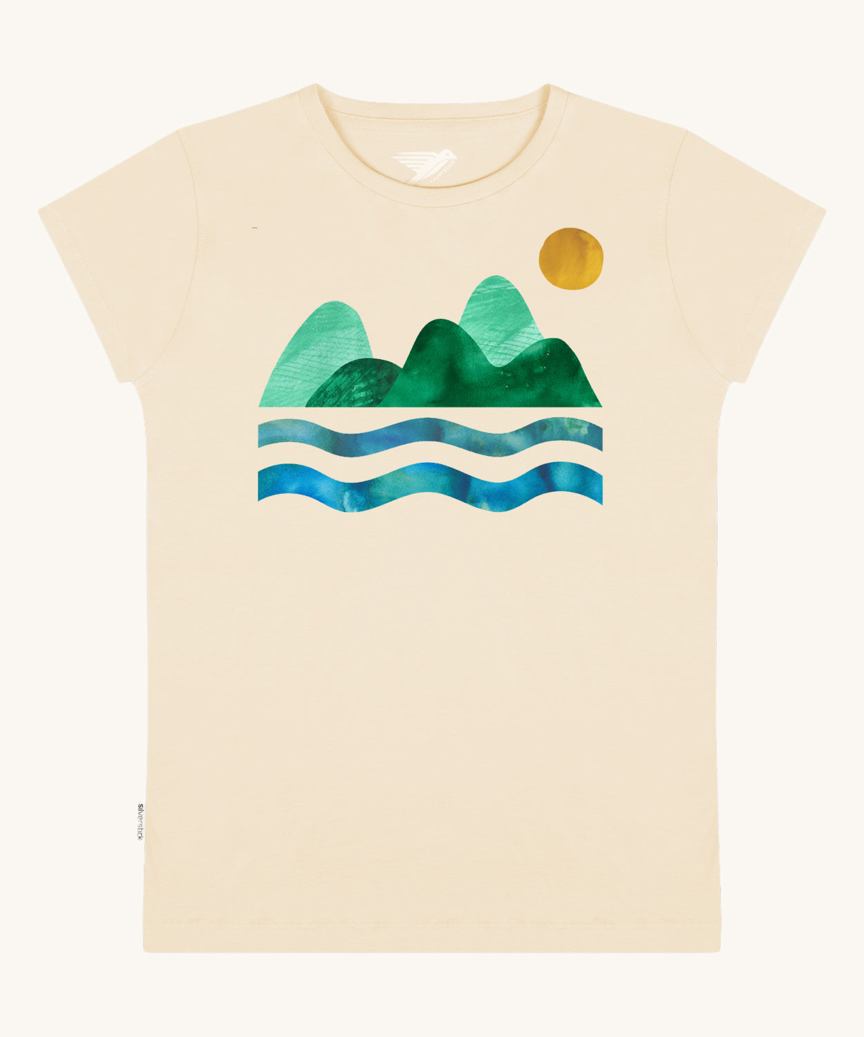Silverstick Habitats Organic T-Shirt in the cream coloured Angora colourway. The front of the t-shirt features a mountain and sea graphic with a sun.
