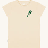 The front of the Silverstick Matt Sewell Rewild Organic women's T-Shirt in the cream coloured Angora colourway. The front of the tee features a green and pink coloured bird graphic on the left chest.