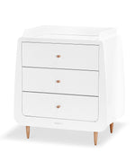 A side angled view of the Natural SnuzKot changing unit pictured on a plain background