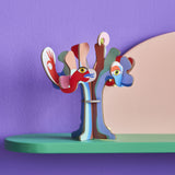 Studio Roof 3D Pop Out Card Dream Tree on a green shelf. A 3D cardboard DIY craft kit tree with different coloured leaves. This kit is part of a wide range of Studio Roof kits that are available at Babipur.