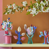 Studio Roof 3D Pop Out Card decorations placed on a shelf. These cardboard DIY craft kits come with a card. This kit is part of a wide range of Studio Roof kits that are available at Babipur.