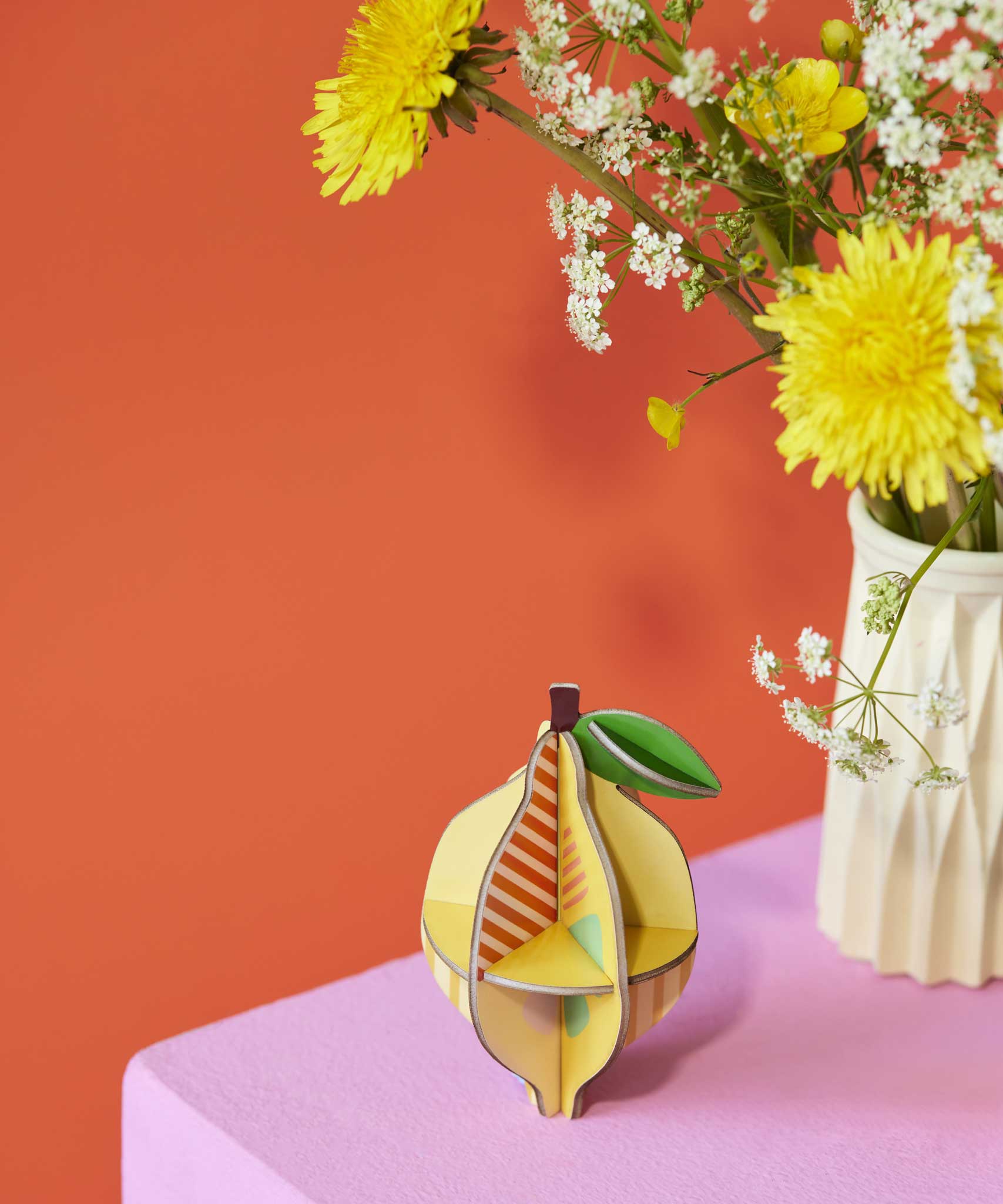 The Studio Roof 3D Pop Out Card Lemon placed on a sideboard next to flowers. This 3D pop out card DIY kit is part of Studio Roof's fruits  collection which is available at Babipur.