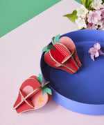 Studio Roof 3D Pop Out Card Strawberries placed on a blue tray. This 3D pop out card DIY kit is part of Studio Roof's fruits collection which is available at Babipur.