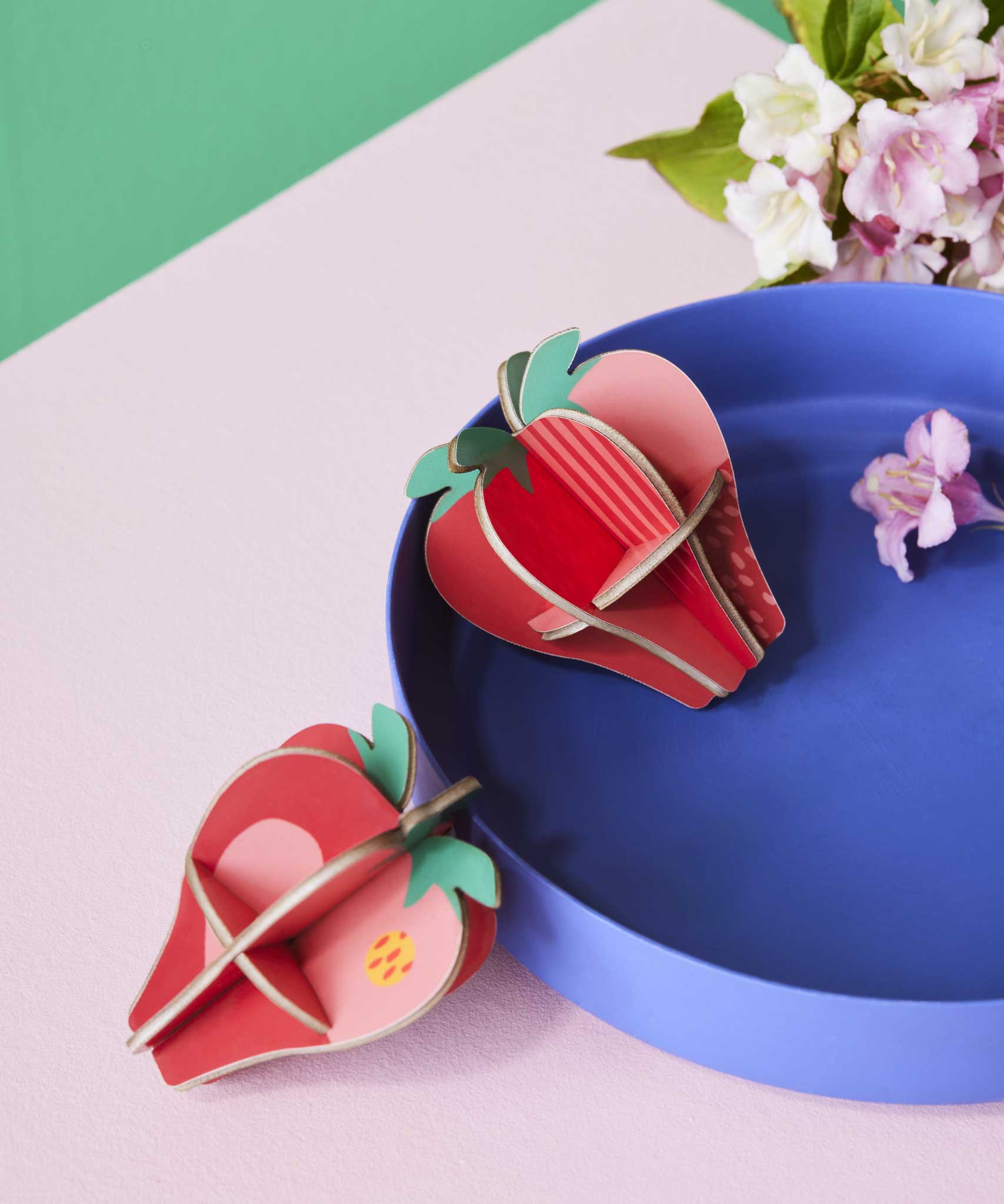 Studio Roof 3D Pop Out Card Strawberries placed on a blue tray. This 3D pop out card DIY kit is part of Studio Roof's fruits collection which is available at Babipur.