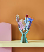 Studio Roof 3D Pop Out Card Tree of Life decoration placed on a shelf. A cardboard DIY craft kit that comes with a card. This kit is part of a wide range of Studio Roof kits that are available at Babipur.