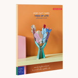 The packaging for the Studio Roof 3D Pop Out Card Tree of Life decoration. A cardboard DIY craft kit that comes with a card. This kit is part of a wide range of Studio Roof kits that are available at Babipur.