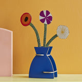 Studio Roof 3D Pop Out Card featuring a Klimt Flowers design placed on a shelf on front of a yellow wall. This 3D pop out card bouquet is part of Studio Roof's artist collection which is available at Babipur.