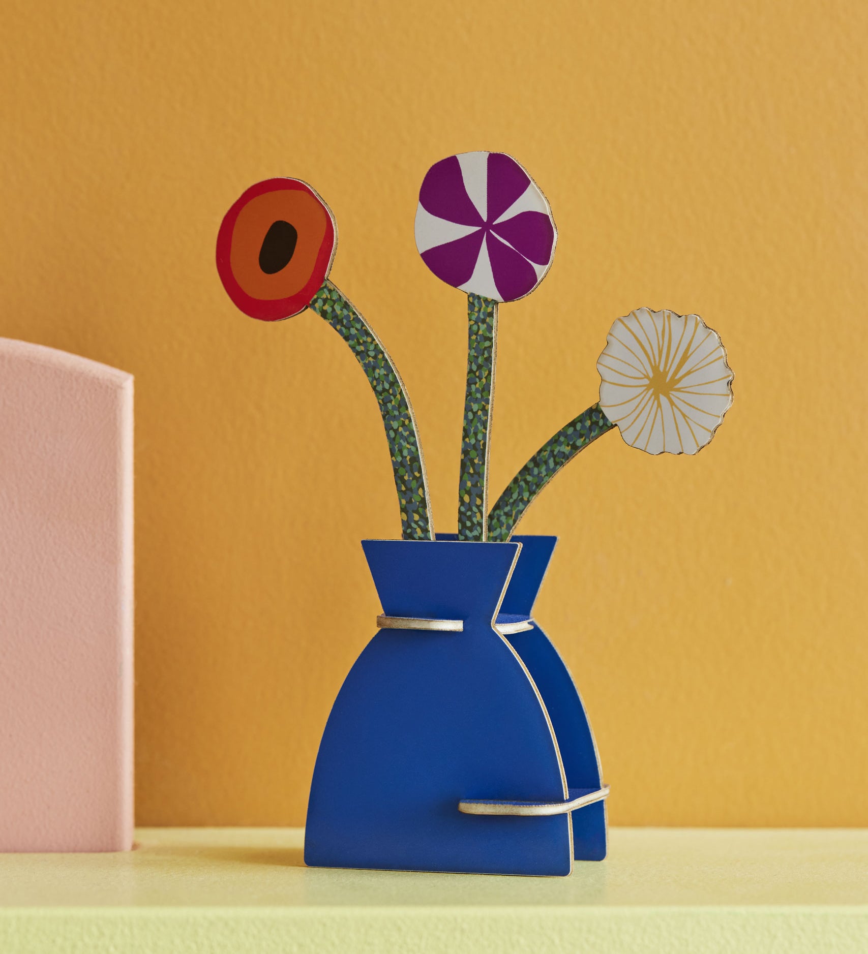 Studio Roof 3D Pop Out Card featuring a Klimt Flowers design placed on a shelf on front of a yellow wall. This 3D pop out card bouquet is part of Studio Roof's artist collection which is available at Babipur.