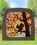 A Toverlux DIY Transparencies with  Autumn Squirrel artwork shown in a wooden magic window frame.