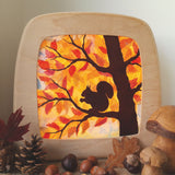 A Toverlux DIY Transparencies with  Autumn Squirrel artwork shown in a Toverlux wooden magic lamp.