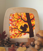 A Toverlux DIY Transparencies with  Autumn Squirrel artwork shown in a Toverlux wooden magic lamp.