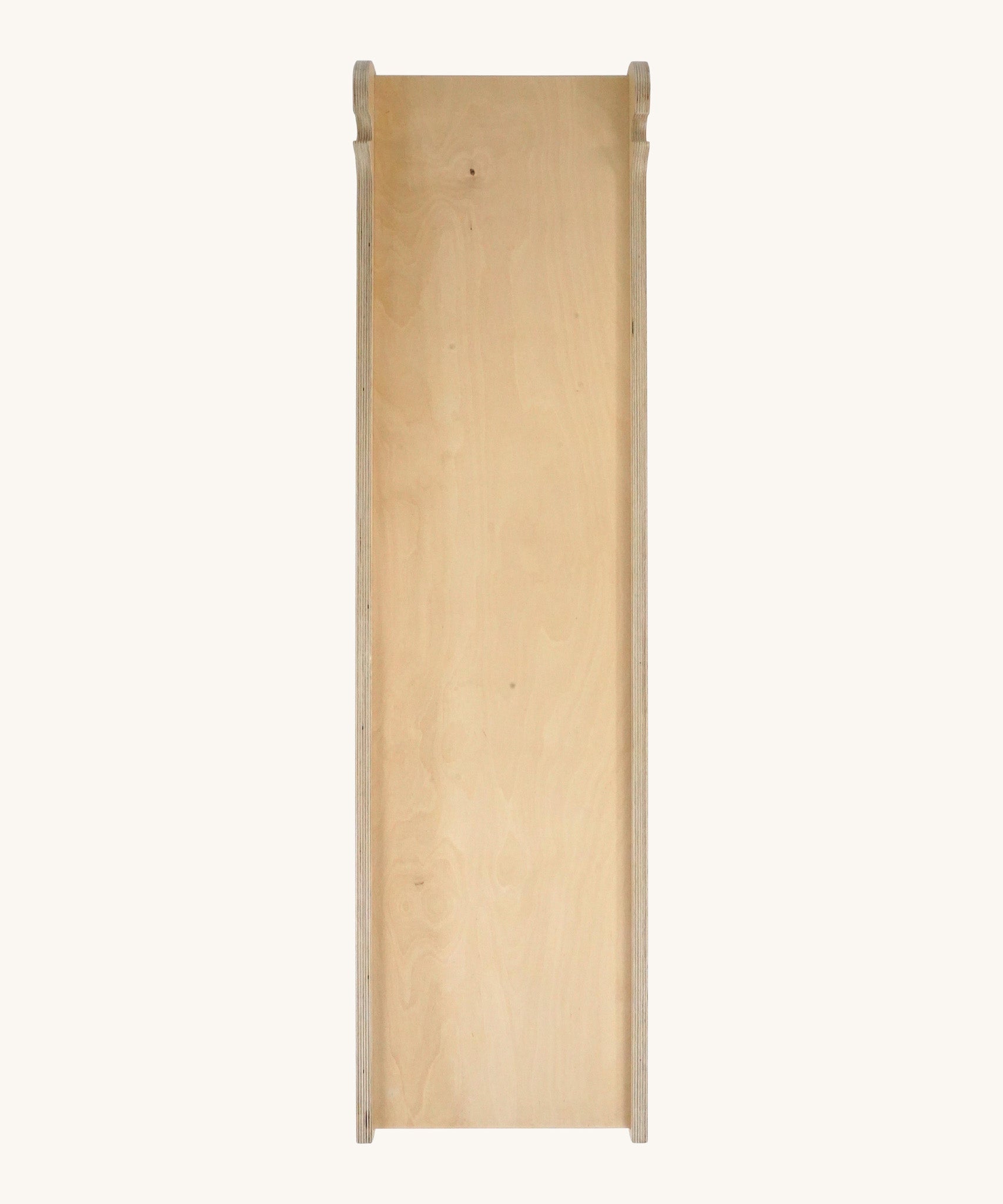 Triclimb wooden Miri slide showing the side that can be used as a slide or as a ramp. Features a joint on one end to hook onto a Triclimb pikler climbing frame