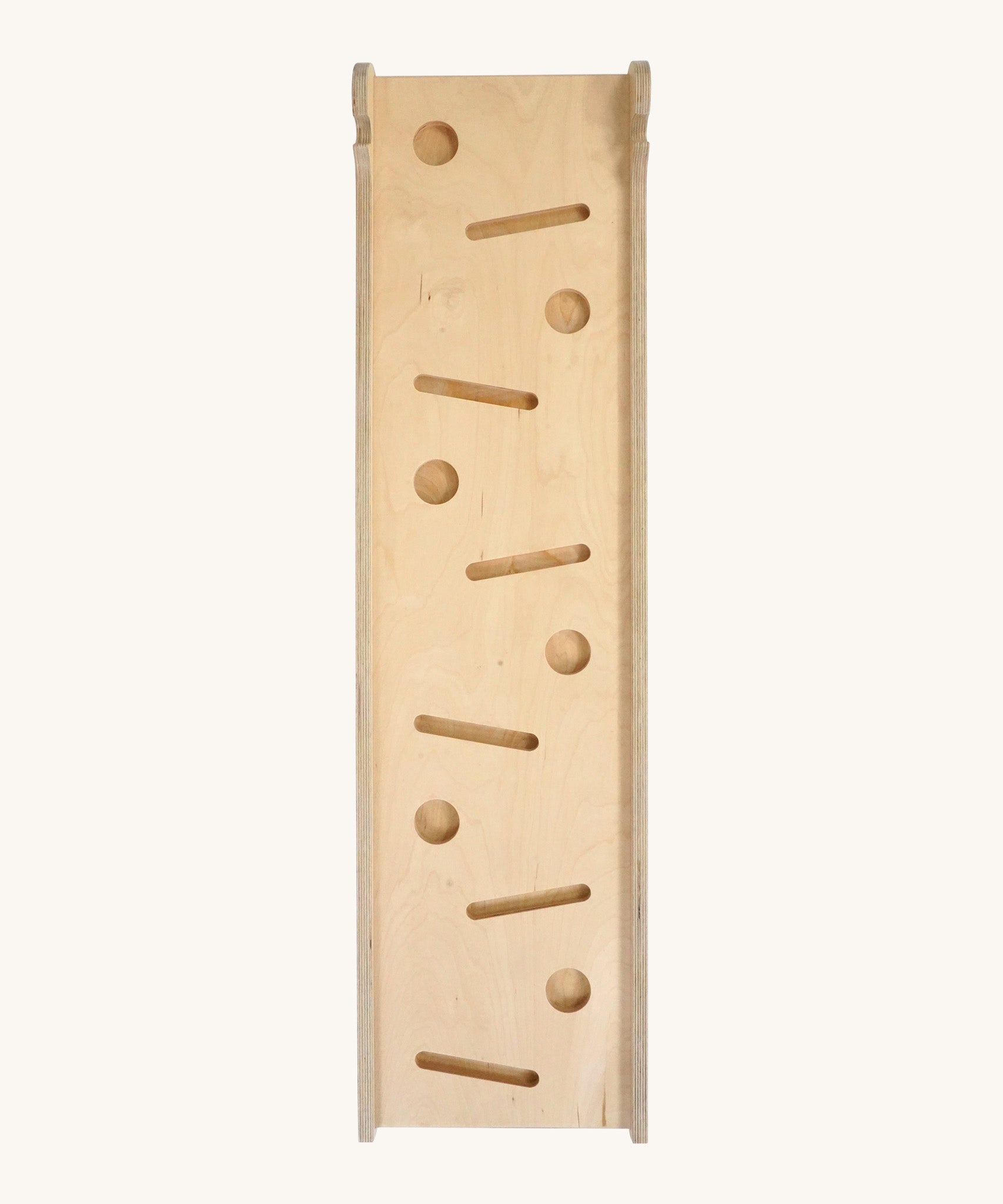 Triclimb wooden Miri slide. A reversible slide that can be used as a ball run, slide and ramp. Showing the different slots for the Triclimb Miri sticks and balls. Features a joint on one end to hook onto a Triclimb pikler climbing frame
