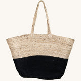 The Turtle Bags hand woven and fair trade jute basket bag with handles, and a black colour block design