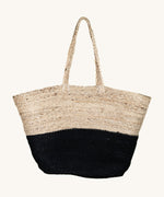 The Turtle Bags hand woven and fair trade jute basket bag with handles, and a black colour block design