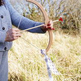 An adult getting ready to take aim with the Vah Easy Aim Bow with Safety Arrows Set.