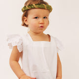 Child wearing the vah green Isabella Medieval Veil and a white dress