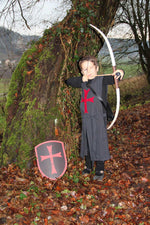 Child in fancy dress costume taking aim with the Vah Junior Wooden Bow