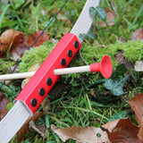 The Vah Mini Wooden Bow with Safety Arrows pictured on grass outdoors showing close up of arrow and red detail