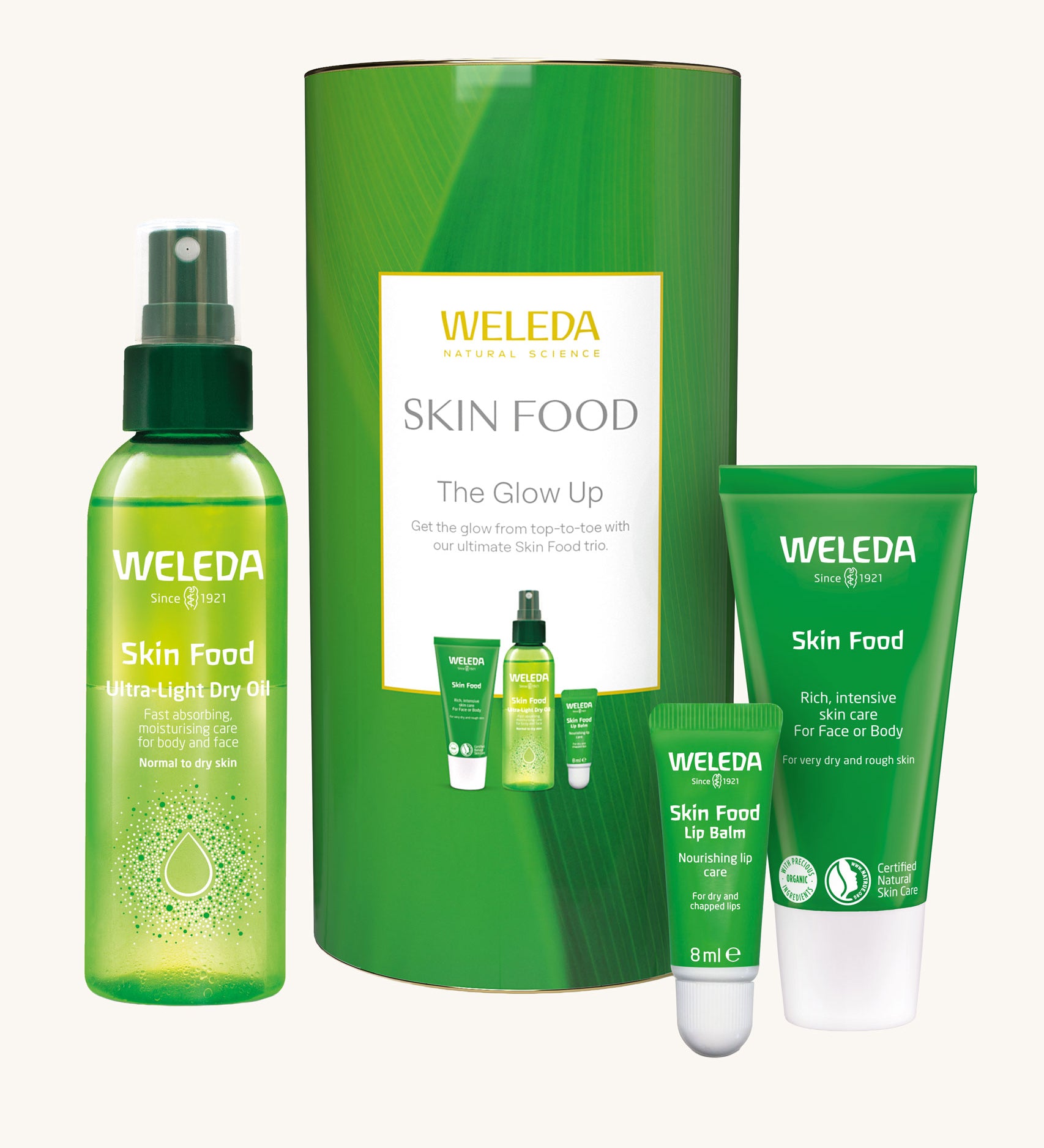 Weleda Skin Food The Glow Up Gift Set. A gift set that contains the Weleda Skin Food ultra light dry oil. lip balm and skin food original all presented in a cylinder shaped tube. Weleda have a range of luxurious, natural skin care items available at Babipur.