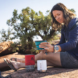 An adult lying down in a tent