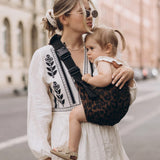 Wild ride carrier being worn my mum with baby in.