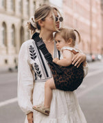 Wild ride carrier being worn my mum with baby in.