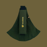 Wildride toddler carrier in army green. A 100% cotton seat stylish hip carrier for babies with brand name in yellow on the strap that's folded over the carrier's seat